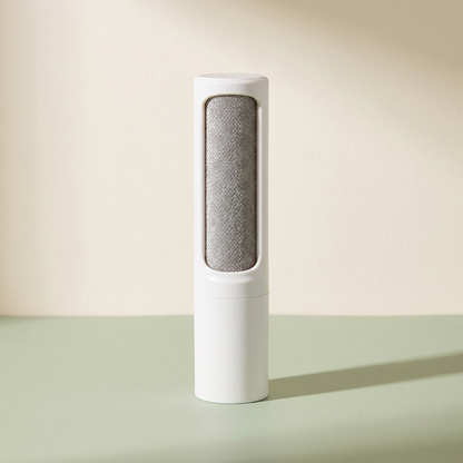 Reusable pet hair remover on a clean neutral background