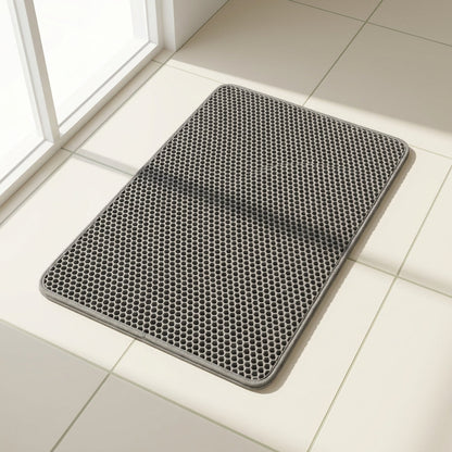 Grey honeycomb cat litter mat on a clean floor