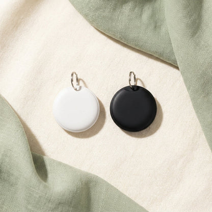 White and black smart pet tracker tag options