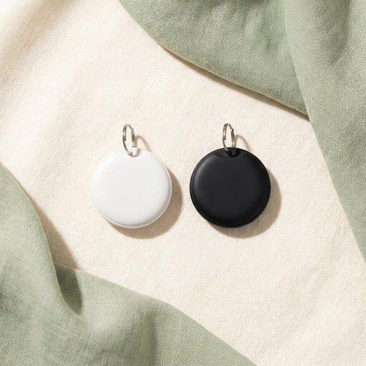White and black smart pet tracker tag options