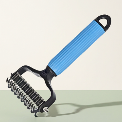 Dematting and deshedding undercoat rake on a clean neutral background
